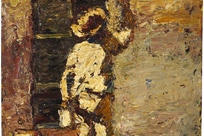Painter at work on a house wall